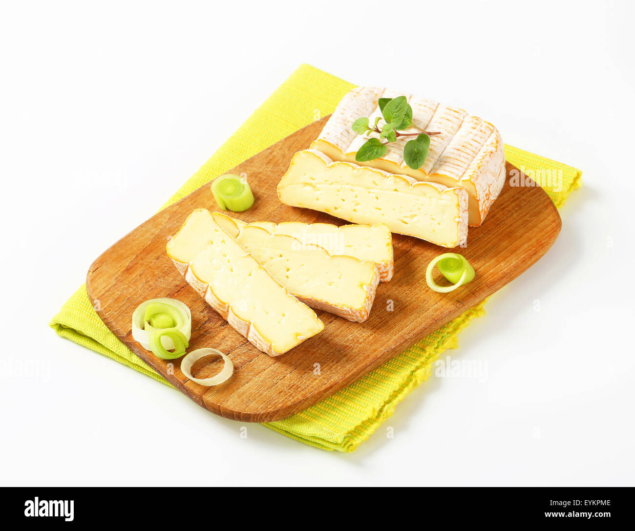 French soft cheese with chopped leek on cutting board Stock Photo Alamy