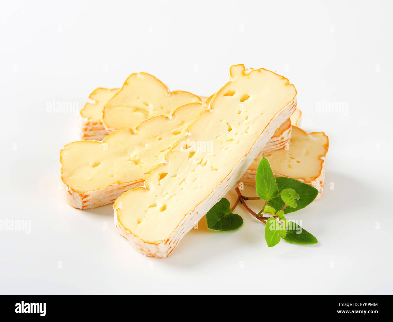 Slices of Alsatian Munster cheese Stock Photo Alamy