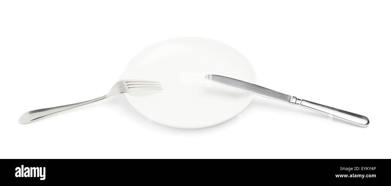 Knife and fork over the plate isolated Stock Photo Alamy