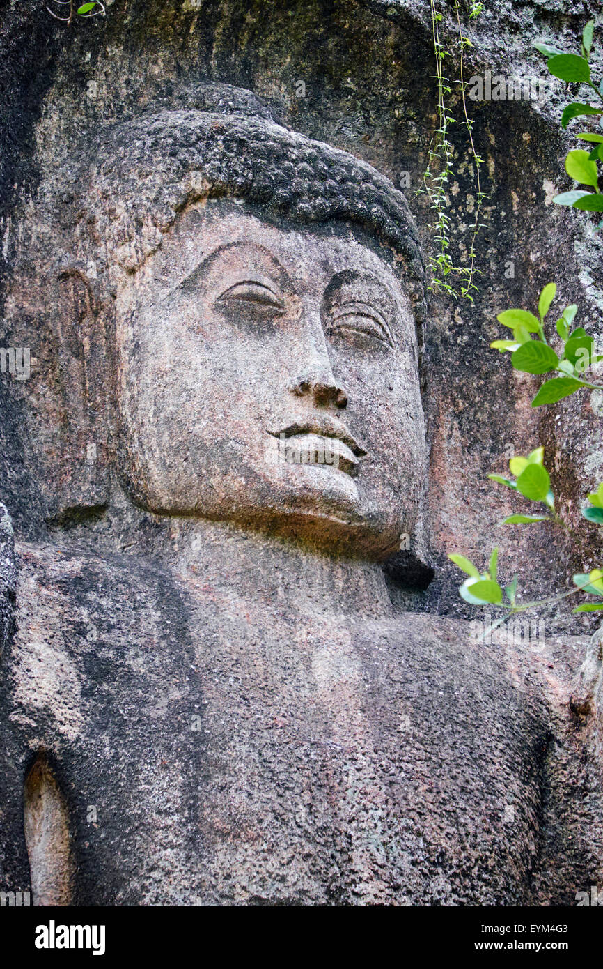 Sri Lanka, Ceylon, Central Province, Ella, Dowa Rock Temple, Buddha statue carved in a rock Stock Photo