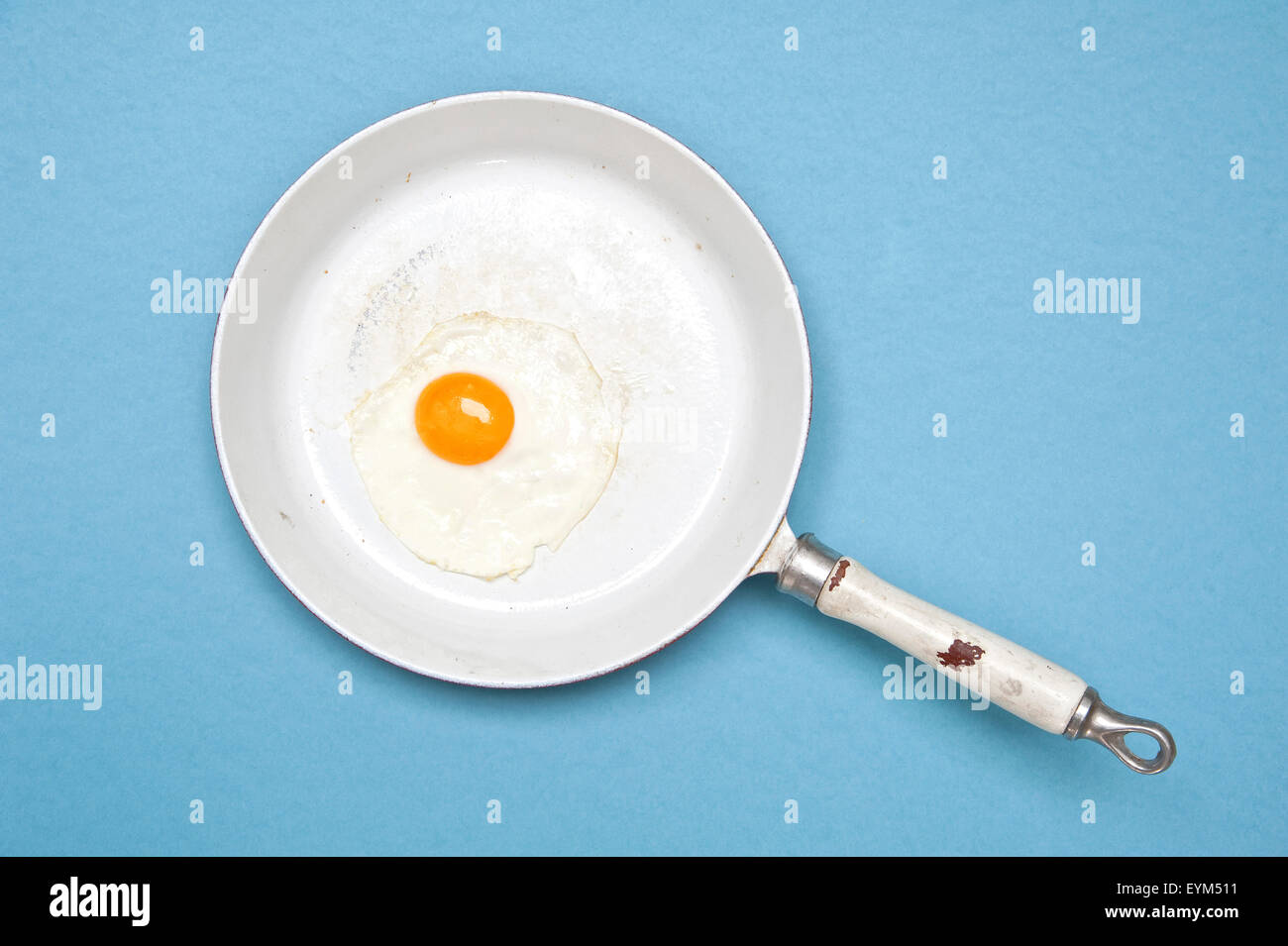 Frying pan, fried egg, blue subsoil, Stock Photo