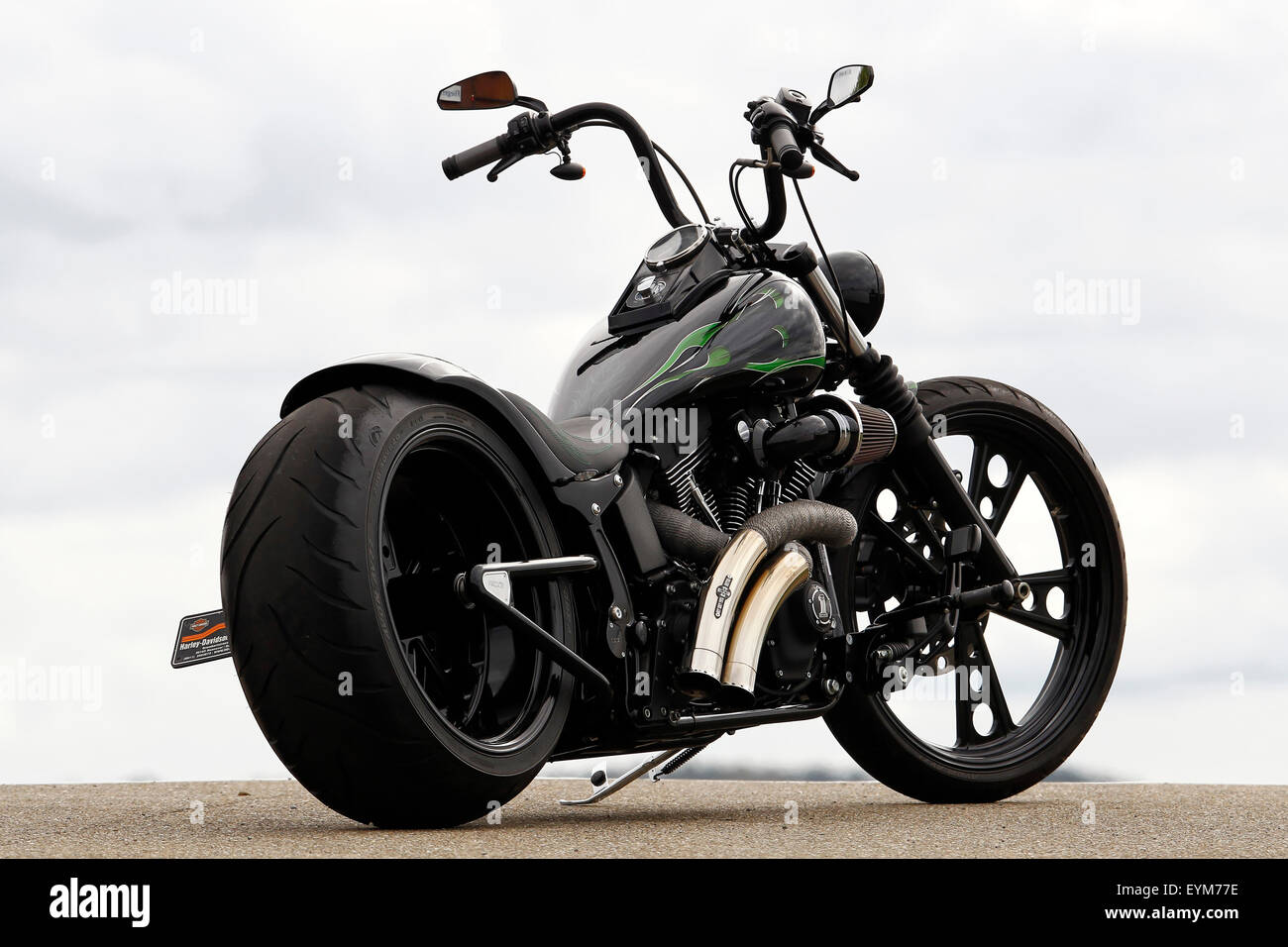 Motorcycle, mood bike, chopper, black, static, diagonally from behind, Custom bike on Harley Basis, year of construction in 2011, extremely wide rear tire, Stock Photo