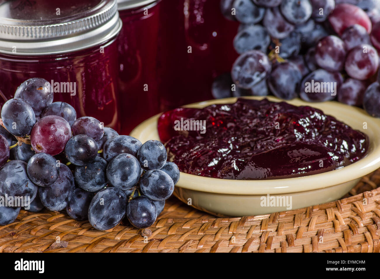 Grapes and bowl of grape jelly on a tray Stock Photo Alamy