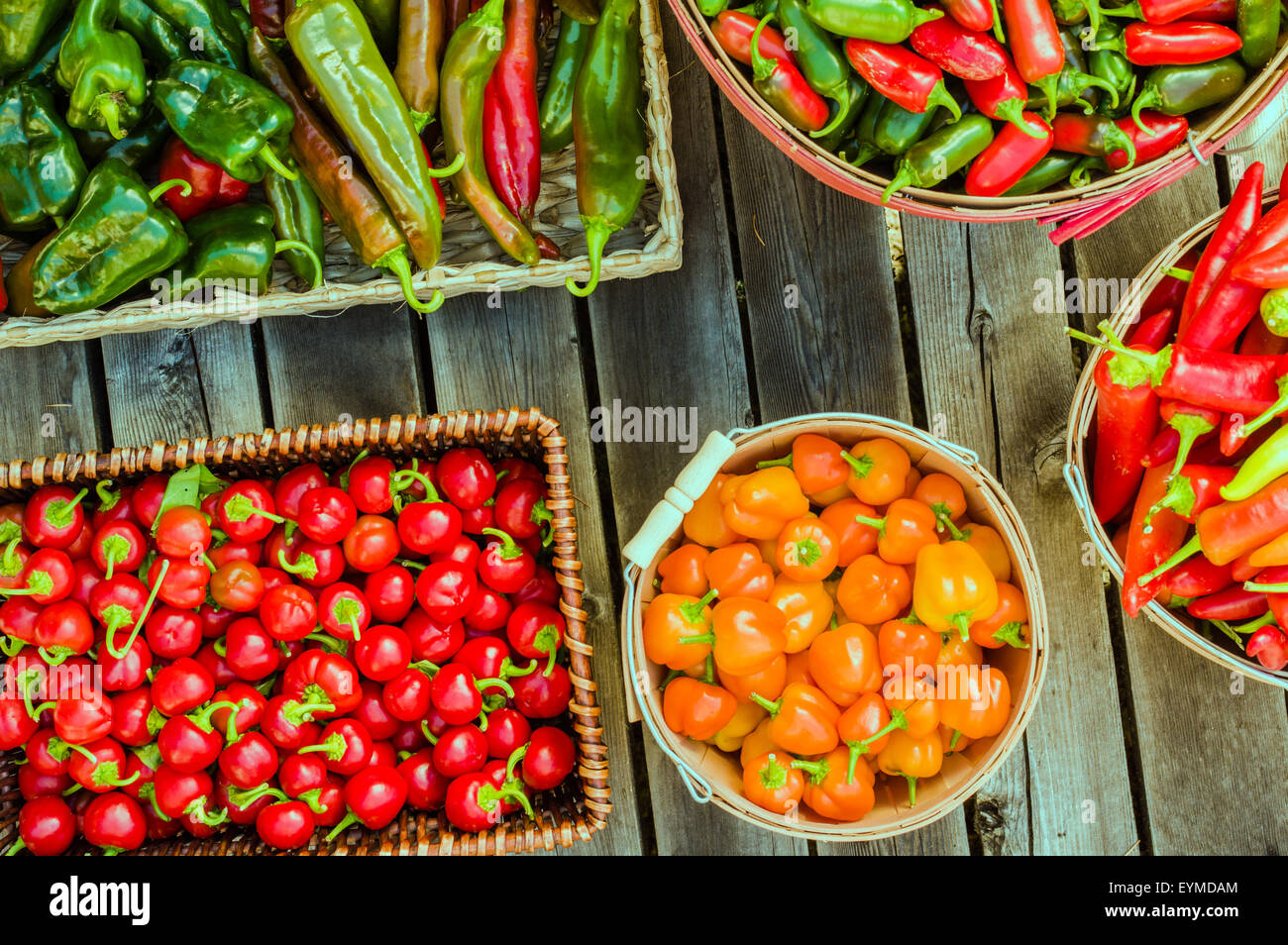 Different hot peppers displayed in various baskets Stock Photo