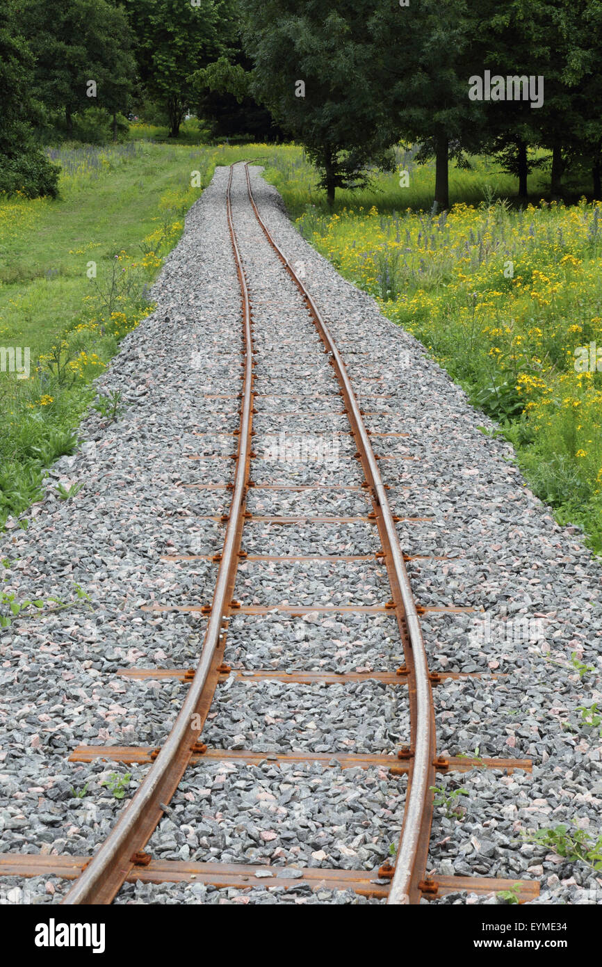 Meadow near railroad track Stock Photo