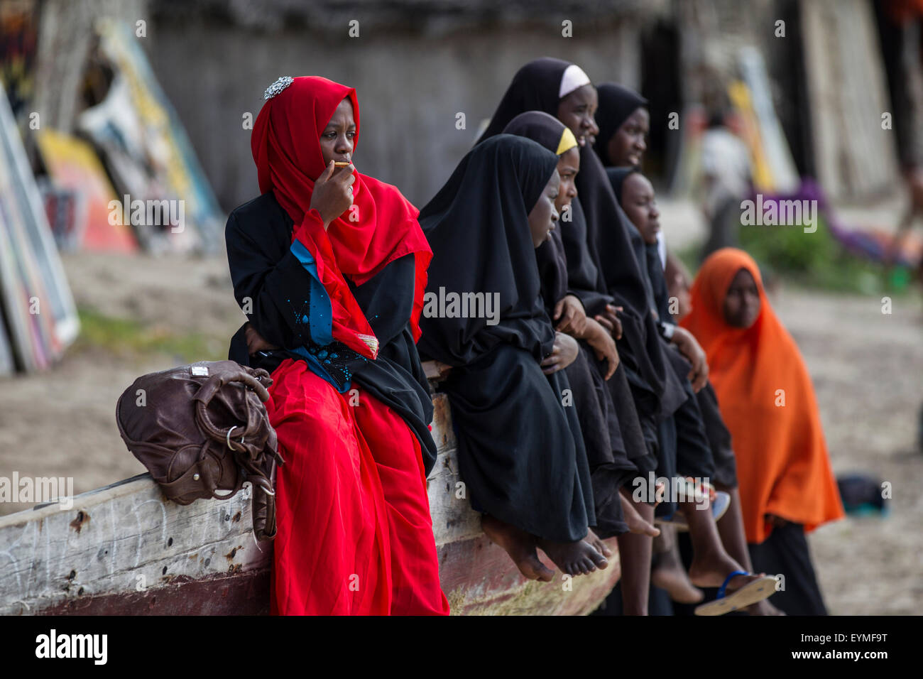 Tanzania, Zanzibar, young woman with red headscarf Stock Photo