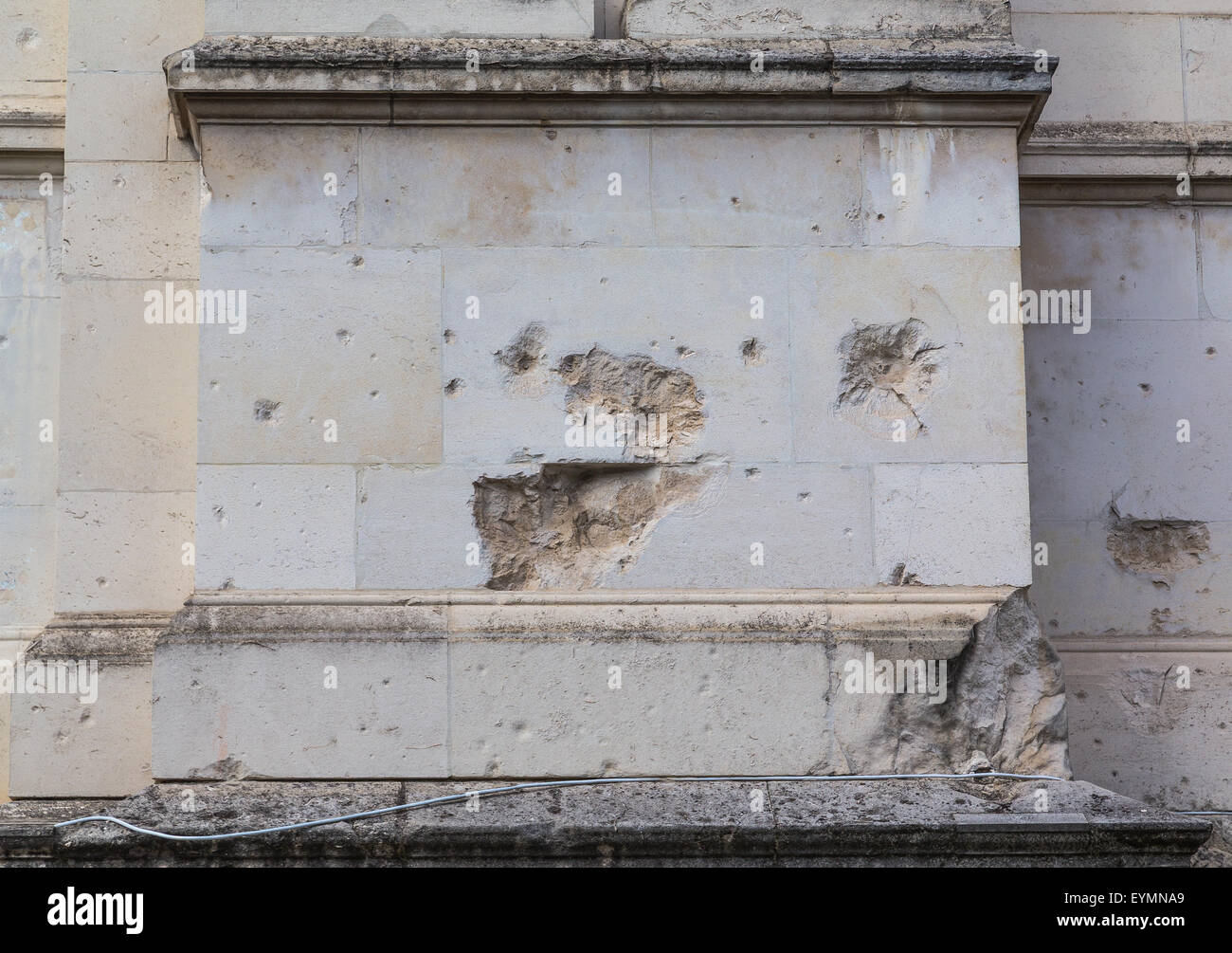 The outside wall of a building in London showing damage to the brickwork. Stock Photo