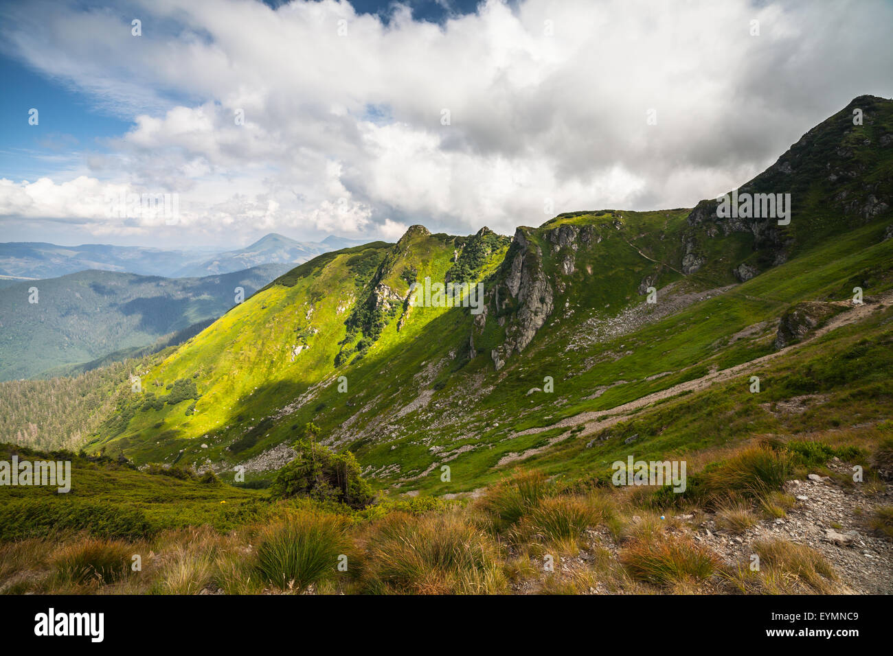 Summer landscape in mountains and the dark blue sky with clouds Stock ...