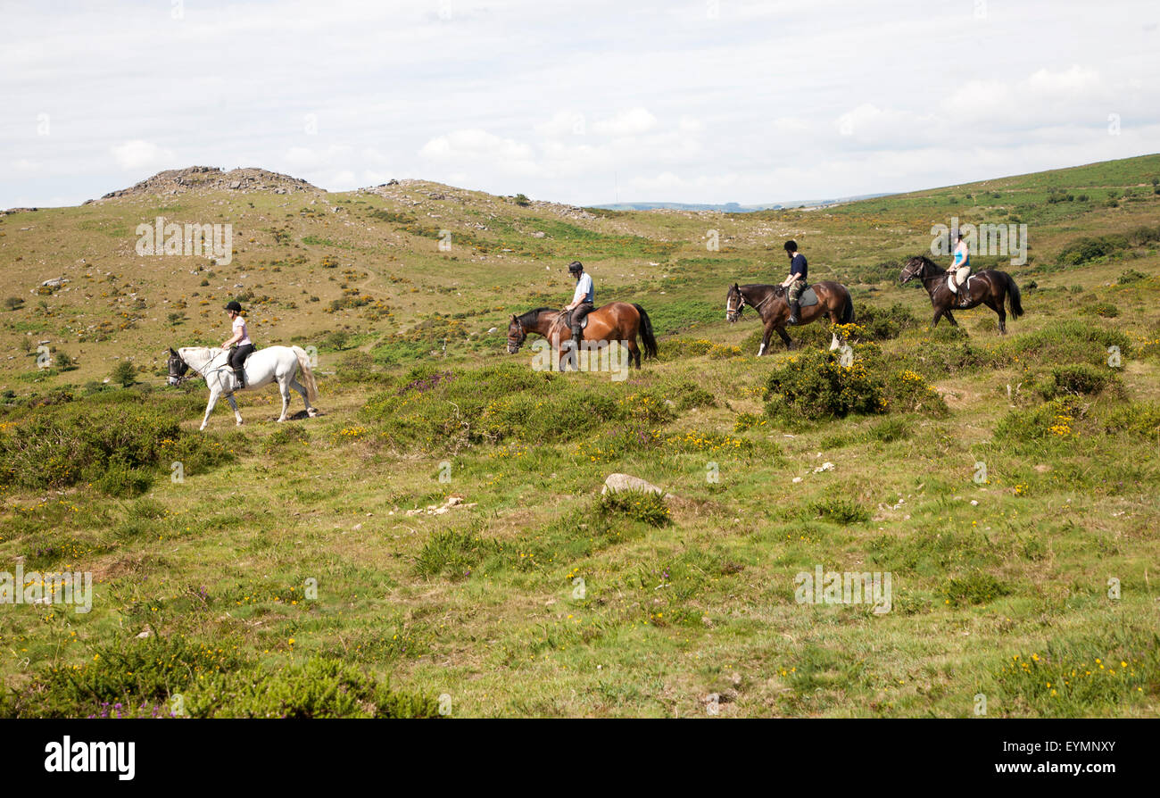 Horses Riding Devon People riding horses by Sharp Tor, Dartmoor national park, Devon ...