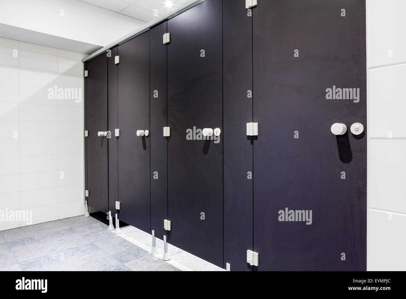 Mens restroom in an public building in black doors Stock Photo Alamy