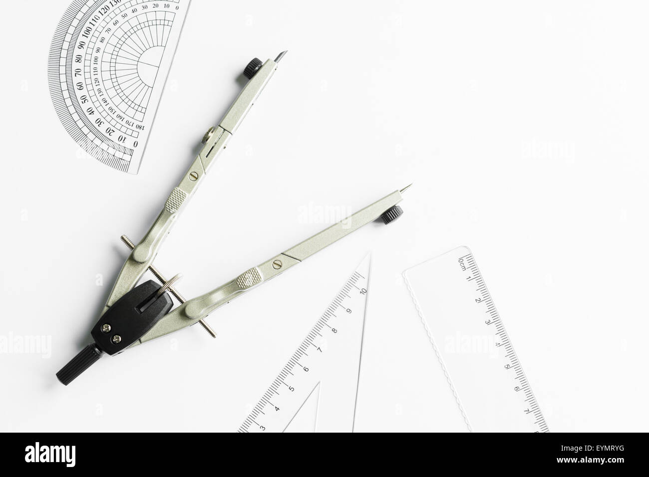 Compass and other measuring equipment on white paper Stock Photo - Alamy