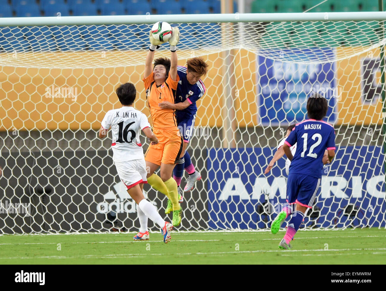 Wuhan, China's Hubei Province. 1st Aug, 2015. Goalkeeper Hong Myong Hui (2nd L) of the Democratic People' s Republic of Korea (DPRK) saves a goal during the match against Japan at the 2015 EAFF(East Asian Football Federation) Women's East Asian Cup in Wuhan, capital of central China's Hubei Province, Aug. 1, 2015. © Cheng Min/Xinhua/Alamy Live News Stock Photo