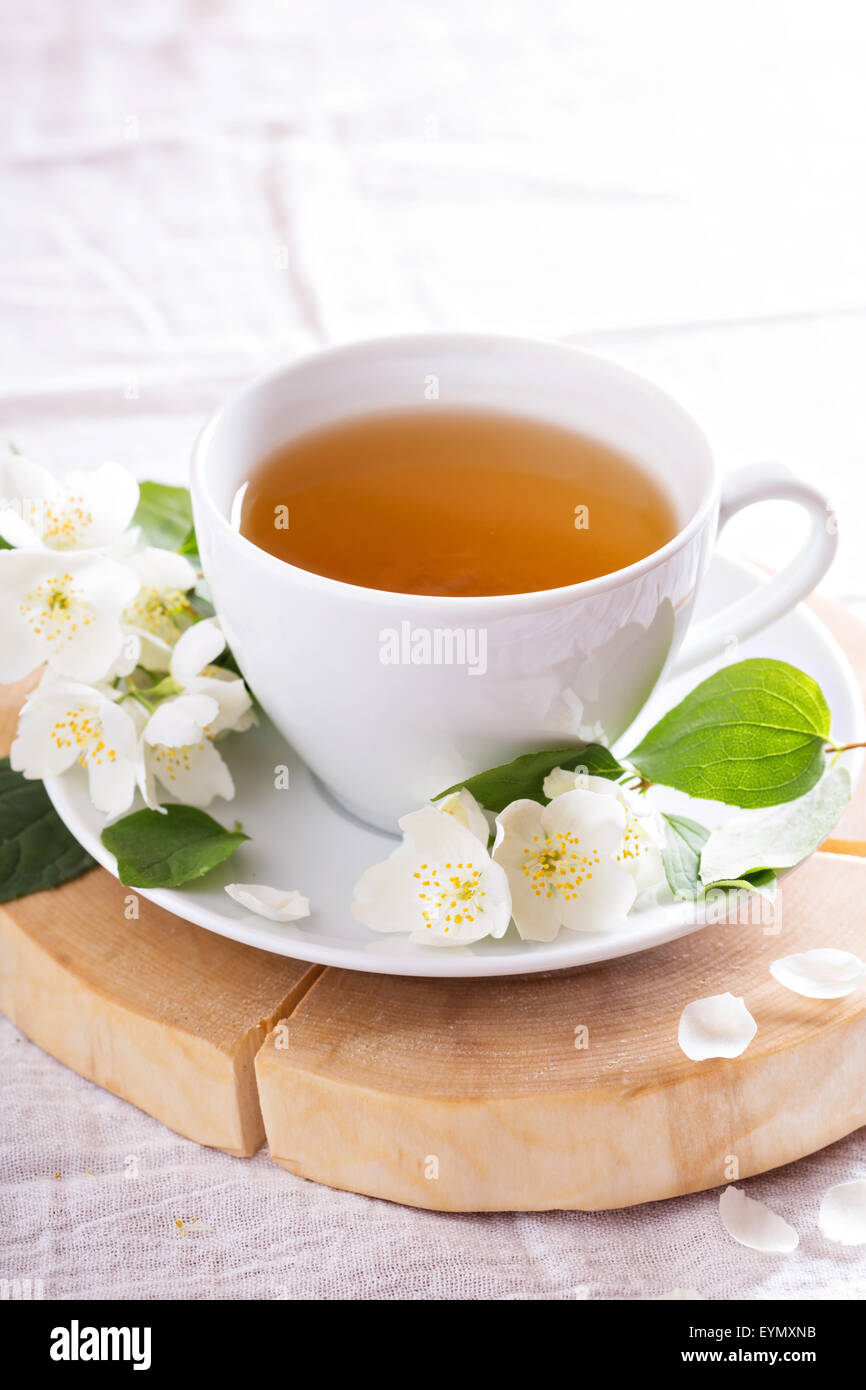 Jasmine tea in a cup with fresh jasmine flowers Stock Photo Alamy