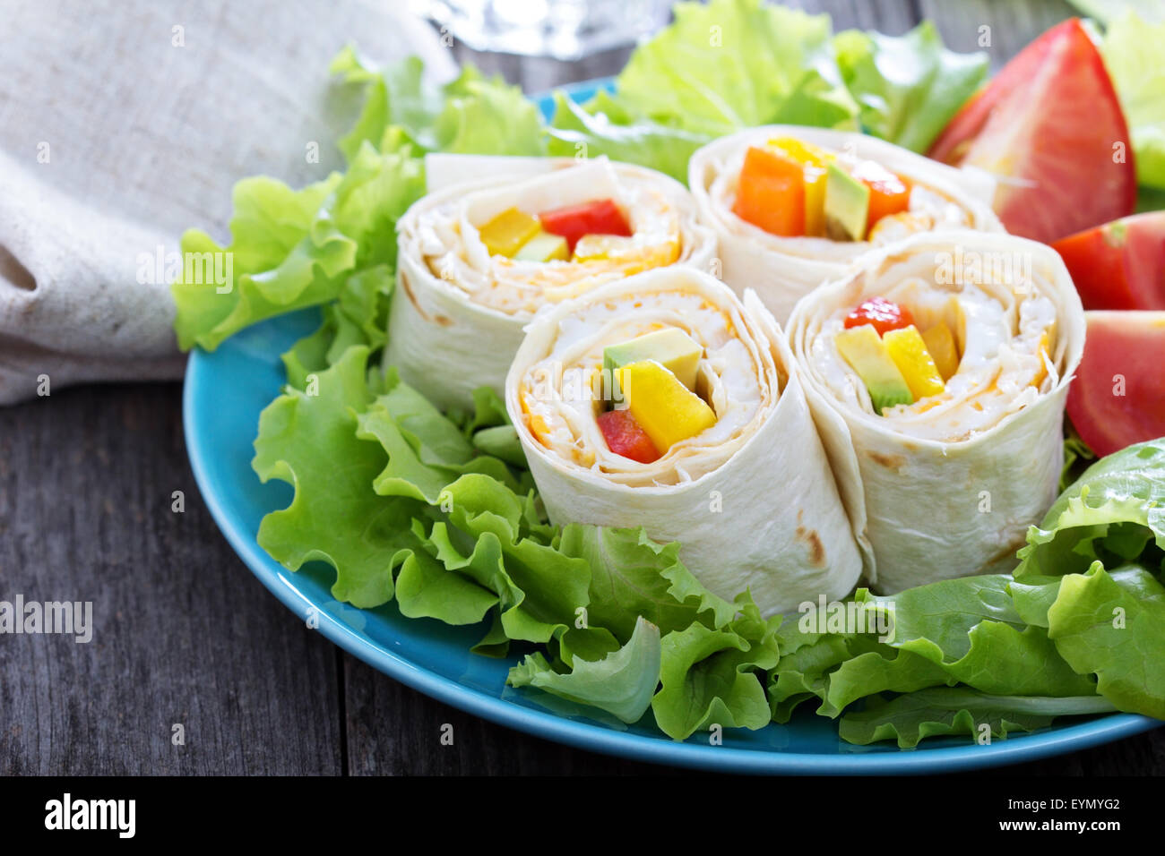 Healthy lunch snack tortilla wraps with omelette and vegetables Stock