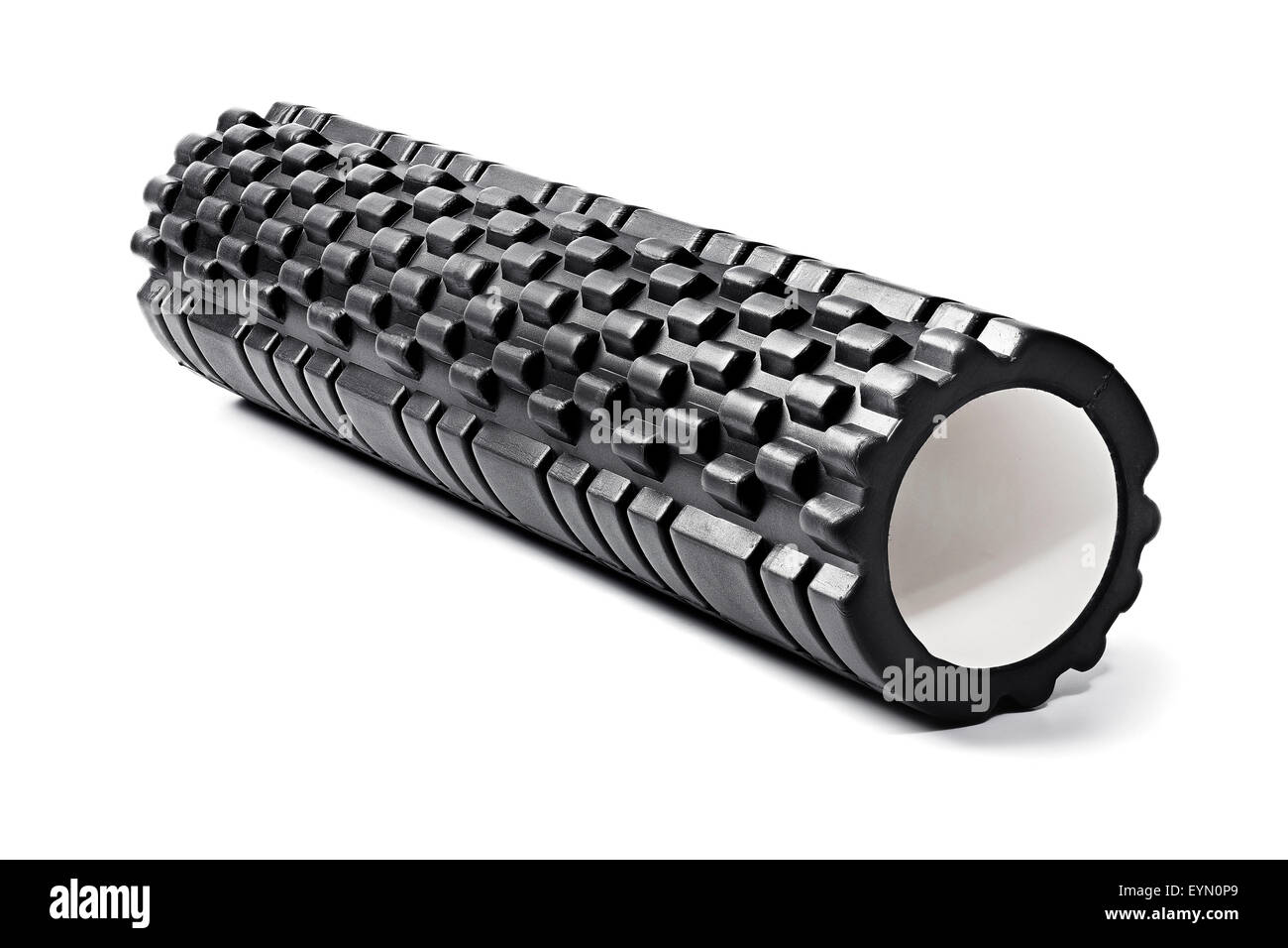 A black bumpy foam massage roller. Foam rolling is a self-myofascial release technique that is used by athletes and physical the Stock Photo