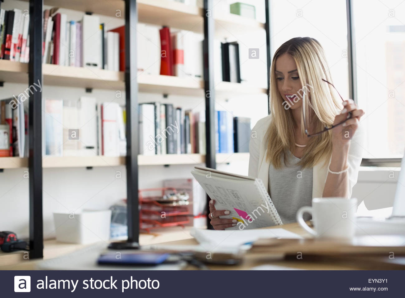 Architect reviewing notes in office Stock Photo