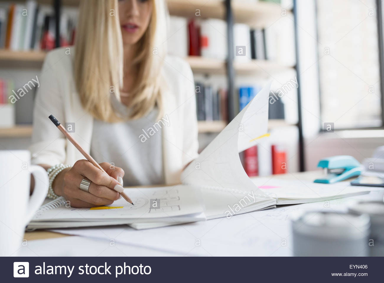 Architect drafting blueprints in office Stock Photo Alamy