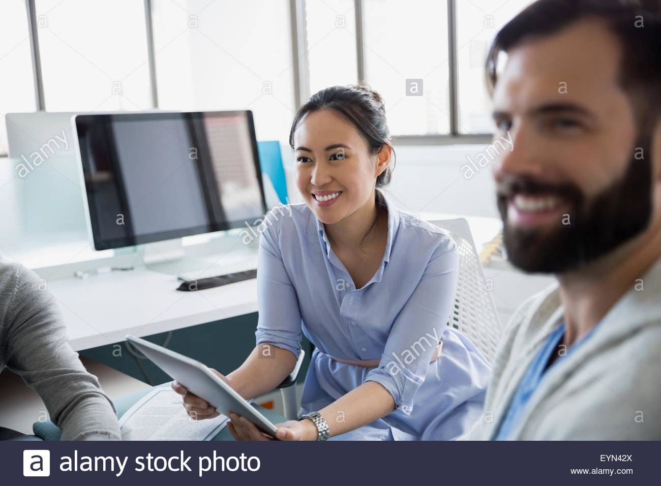 Business people with digital tablet in office Stock Photo