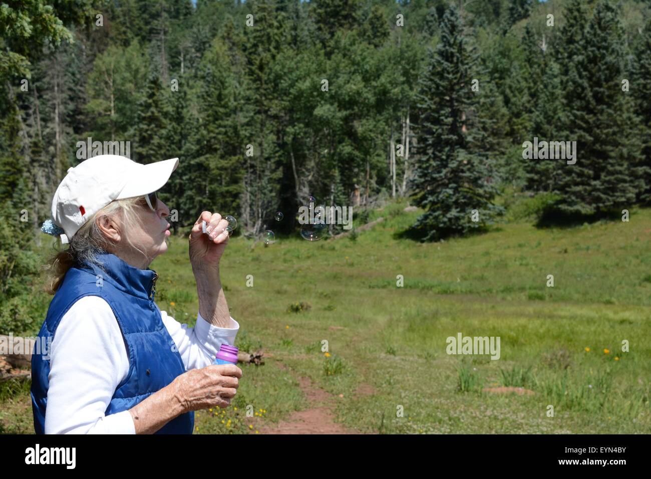 Bubble blowing play for Senior Citizen Stock Photo