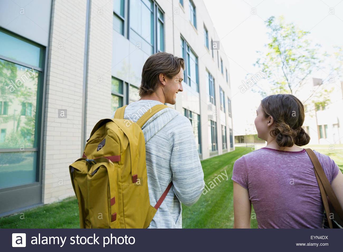 College students with backpack walking on campus Stock Photo Alamy