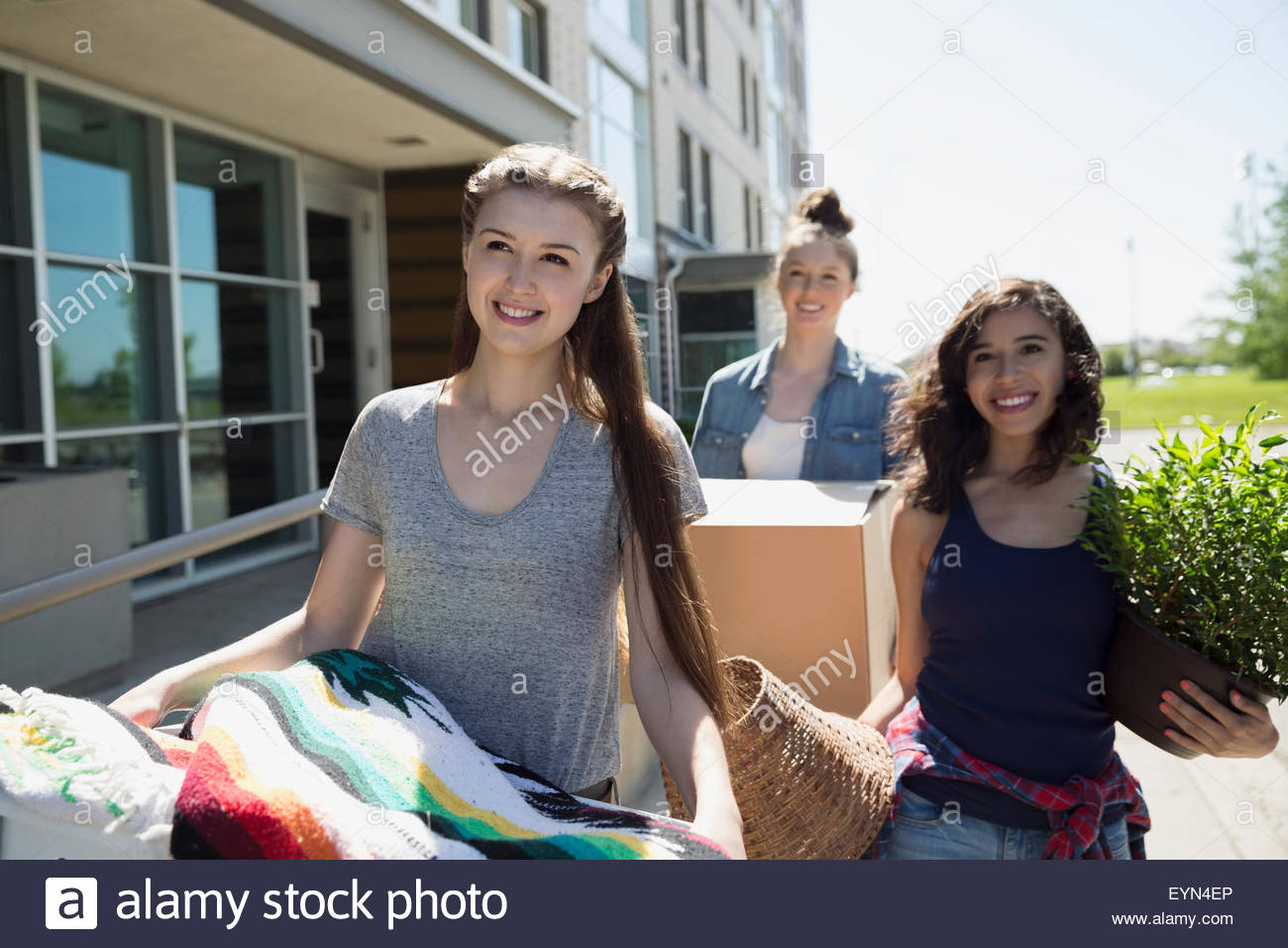 College students moving into college dorm Stock Photo