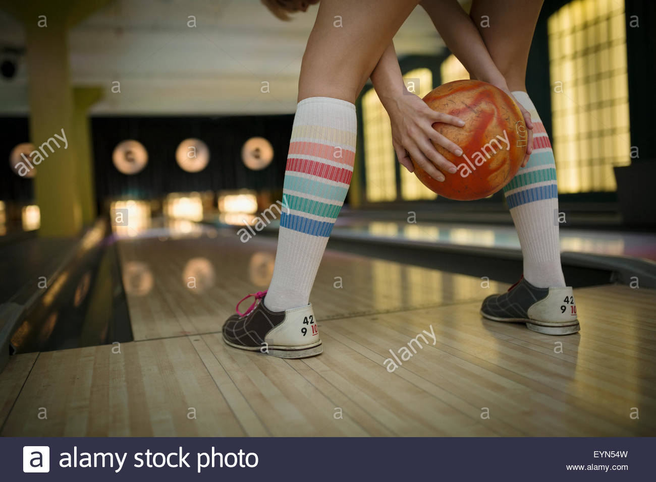 Young woman with kneehigh socks bowling Stock Photo Alamy