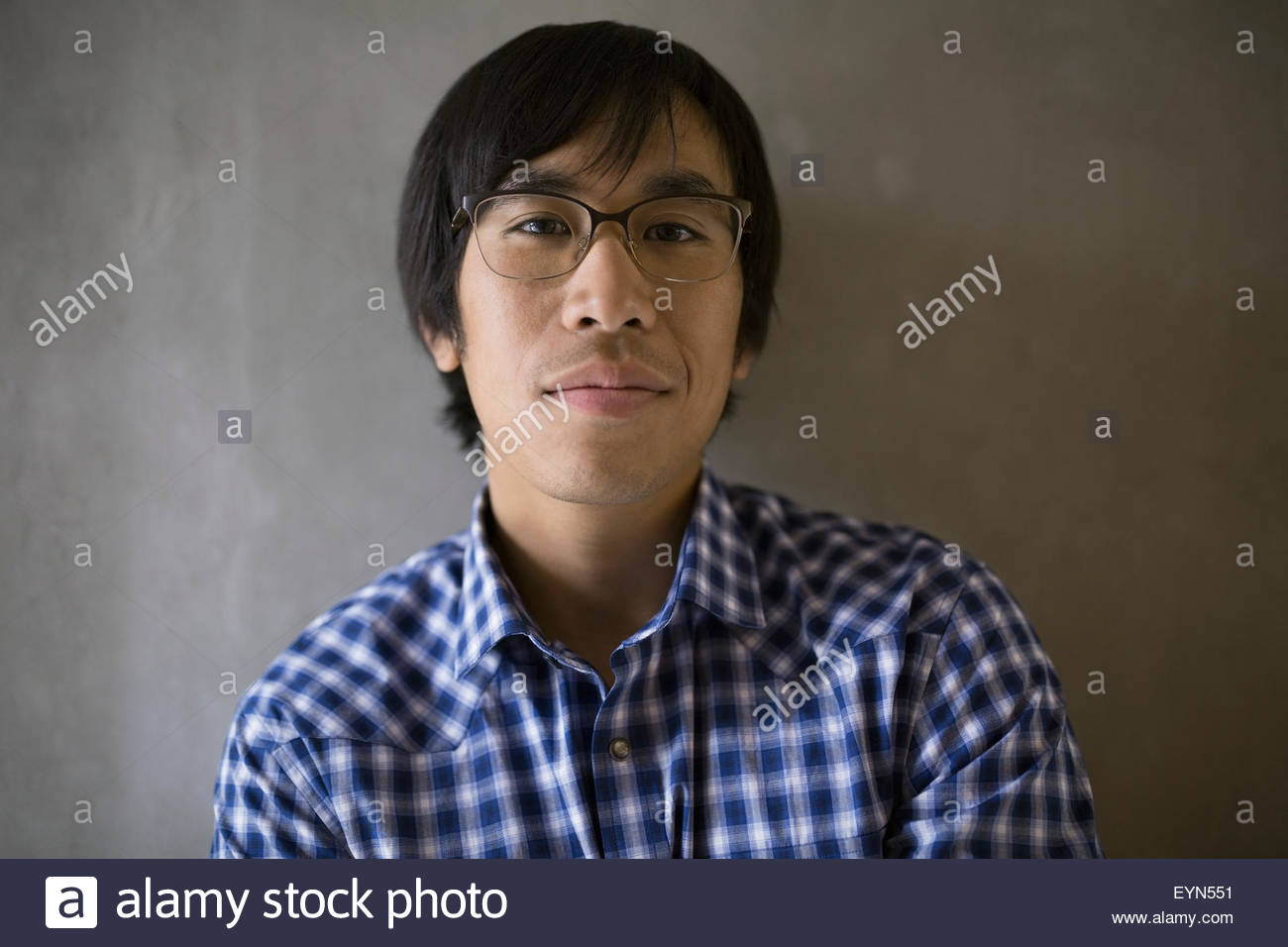 Close up portrait confident businessman black hair eyeglasses Stock Photo