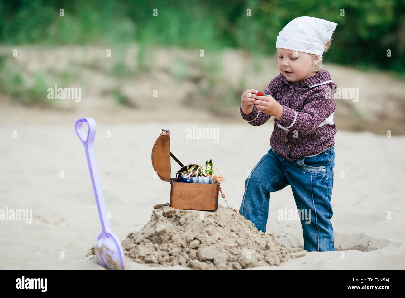 little girl hunting for treasure Stock Photo Alamy