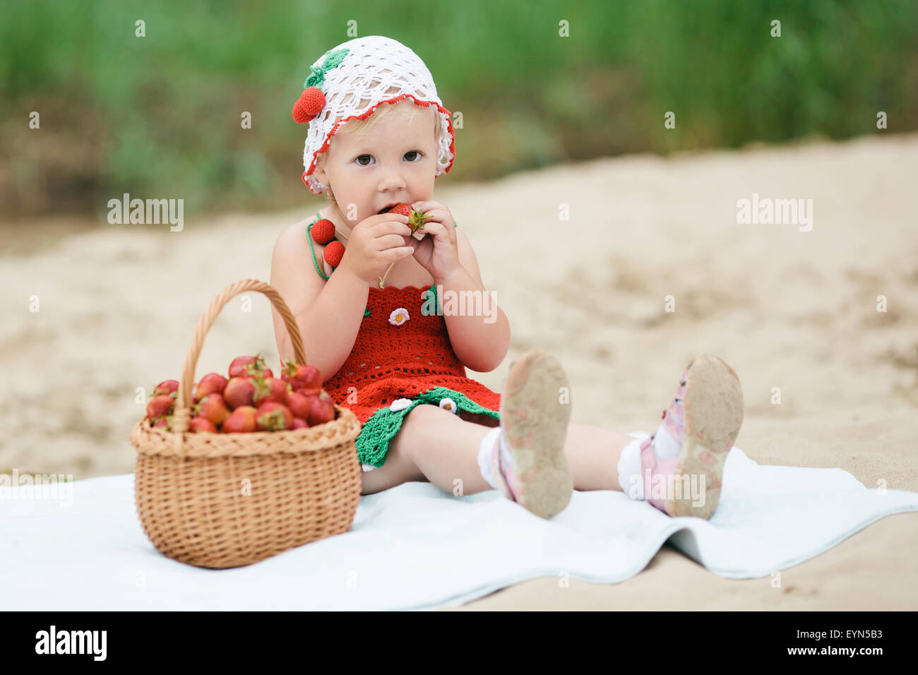 little girl with basket full of strawberries Stock Photo - Alamy