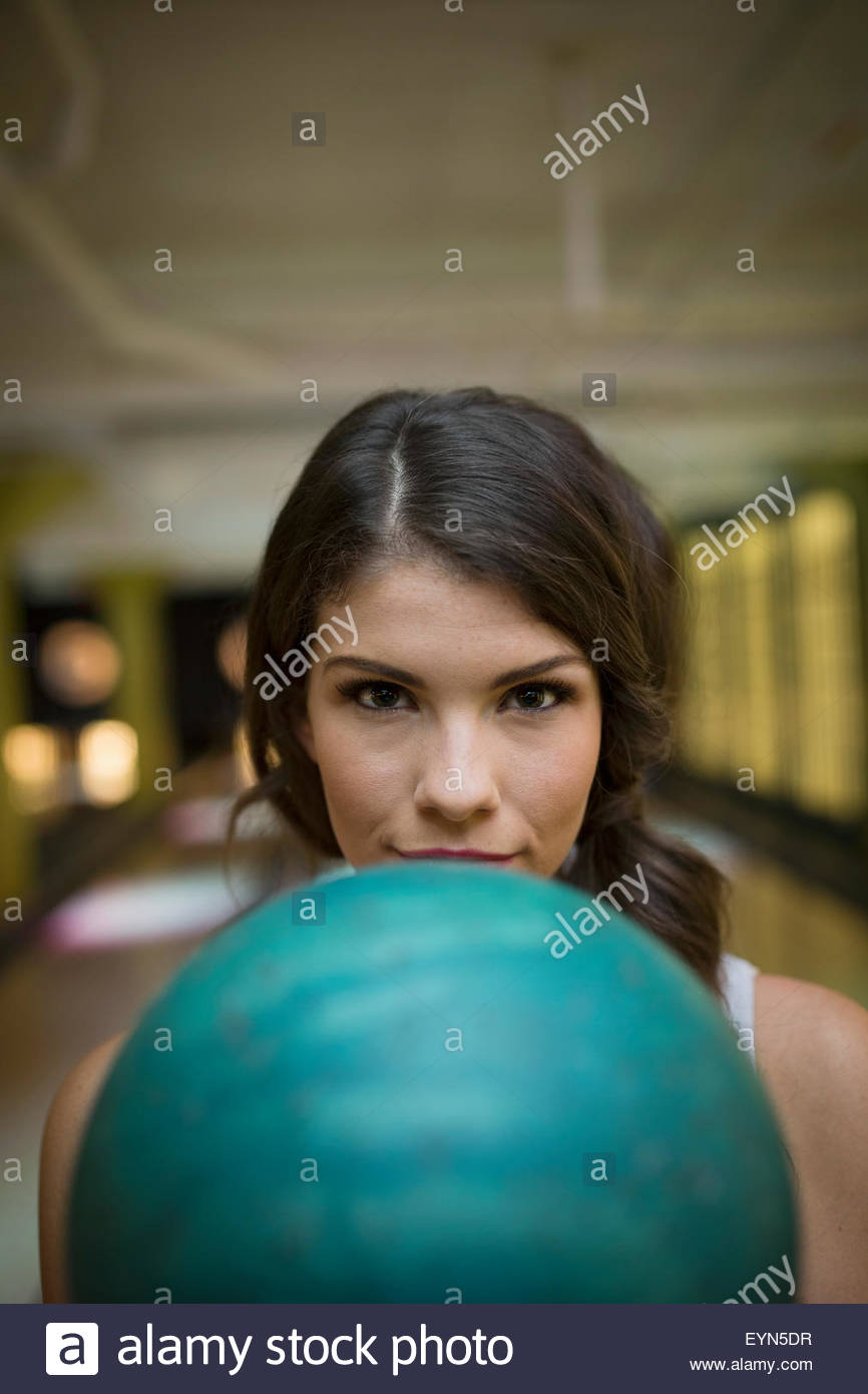 Close up portrait determined young woman bowling ball Stock Photo
