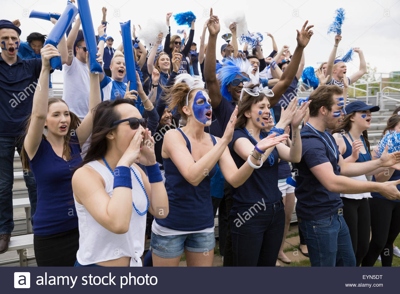 Enthusiastic Crowd In Blue Cheering At Sports Event Stock Photo Alamy