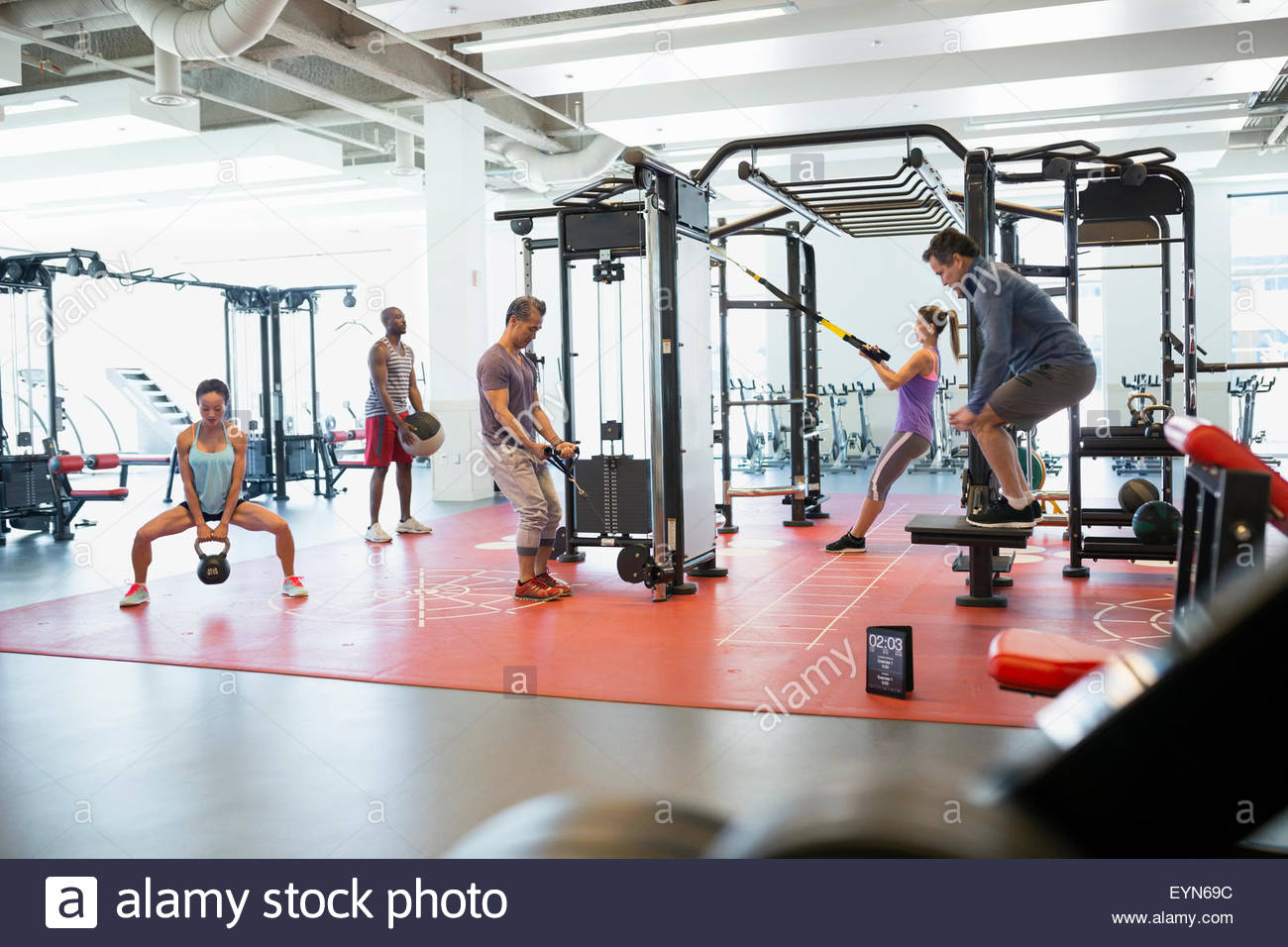 People exercising in gym Stock Photo