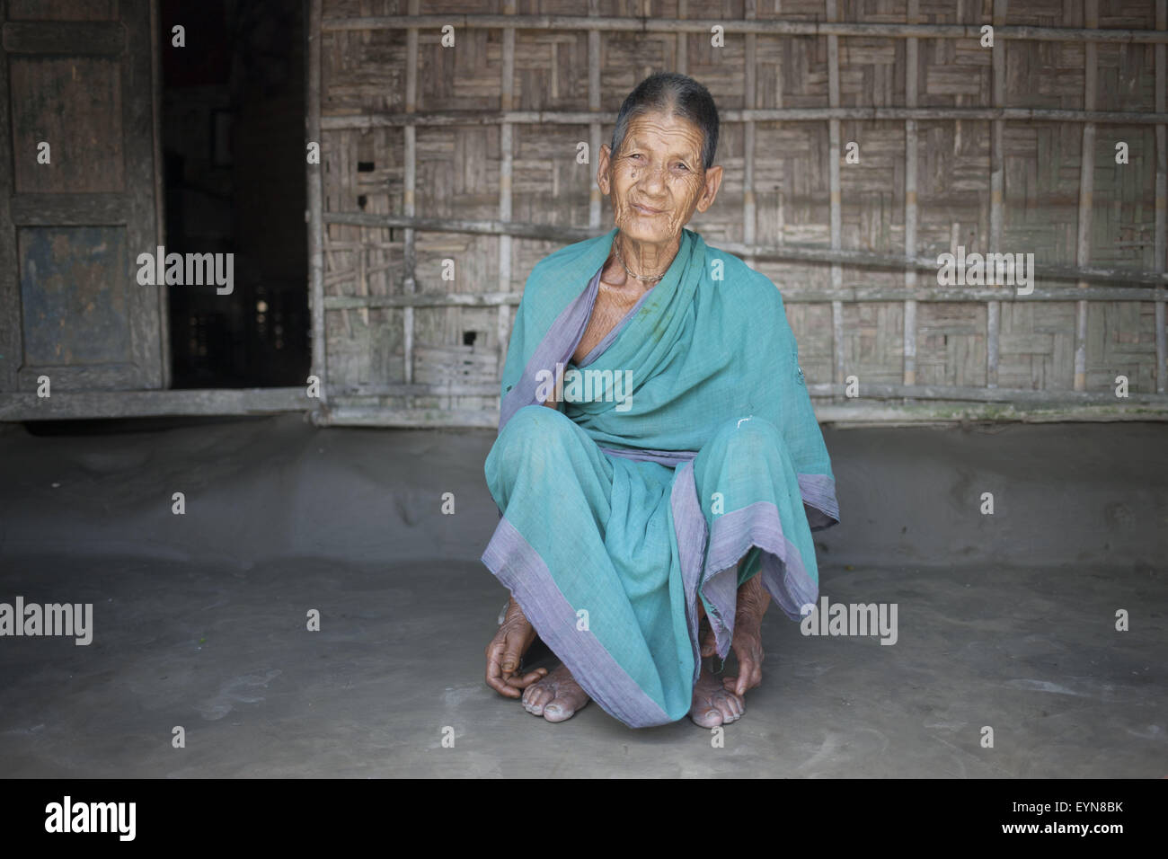Bangladesh. 30th July, 2015. Jiro Bala Barman, 75, sits in front of a house at Dalaha-Khagrabari in the Bangladeshi district of Panchagarh, on July 30, 2015. Bangladesh and India will this week finally swap tiny islands of land, ending one of the world's most difficult border disputes that has kept thousands of people in stateless limbo for almost 70 years. © Suvra Kanti Das/ZUMA Wire/Alamy Live News Stock Photo