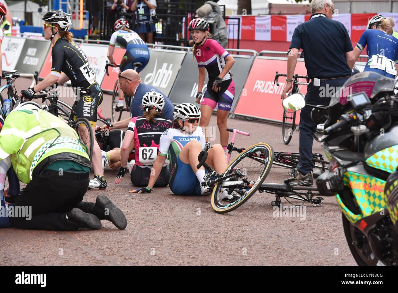London, UK. 1st August, 2015. Cyclists are attended by medics and teammates following a crash with a lap to go at the Prudential RideLondon Grand Prix at The Mall, London, United Kingdom on 1 August 2015. The race, which started at Horse Guards Parade and finished on The Mall, featured many of the world's top female professional cyclists and was won by Barbara Guarischi (Velocio Sports) Credit:  Andrew Peat/Alamy Live News Stock Photo
