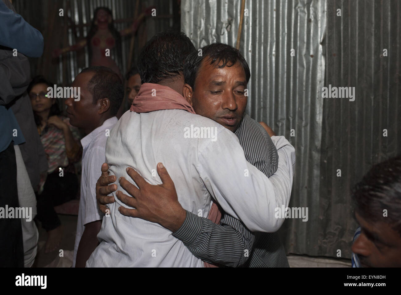 Bangladesh. 31st July, 2015. Hindu devotees from former Indian enclaves embracing each other as they take part in a ritual activity during the celebration at Dasiarchhara, Kurigram, Bangladesh, Aug 01, 2015. © Suvra Kanti Das/ZUMA Wire/Alamy Live News Stock Photo