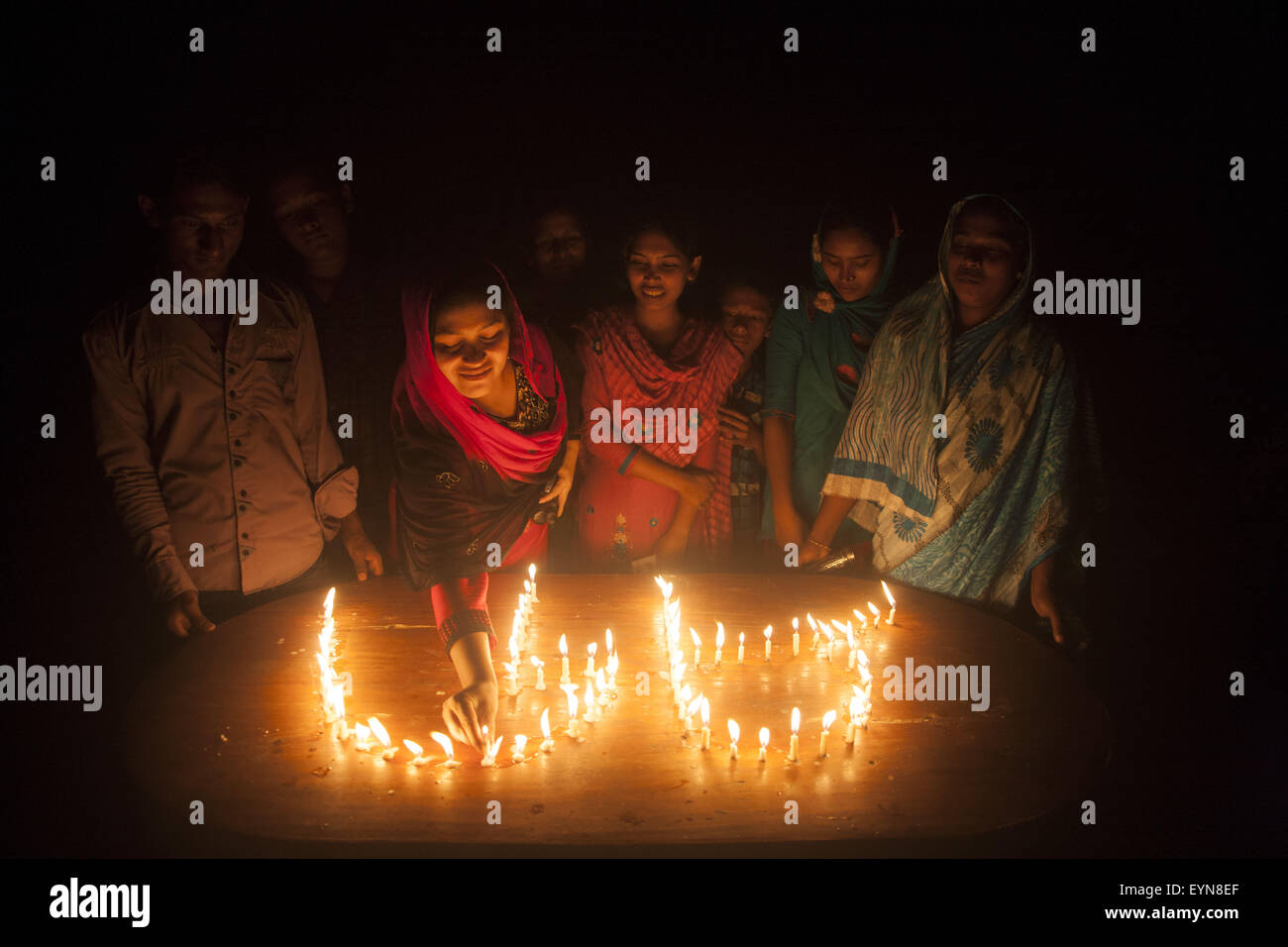 Bangladesh. 1st Aug, 2015. A woman from a enclave lit candles as she take part in the celebration at Dasiarchhara, Kurigram, Bangladesh, Aug 01, 2015. © Suvra Kanti Das/ZUMA Wire/Alamy Live News Stock Photo