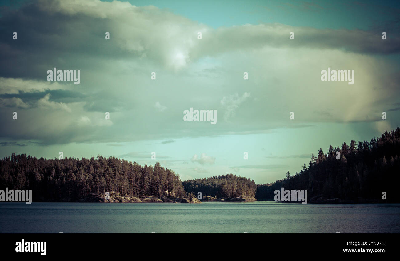 Vintage toned image of lake and forest, Finland Stock Photo