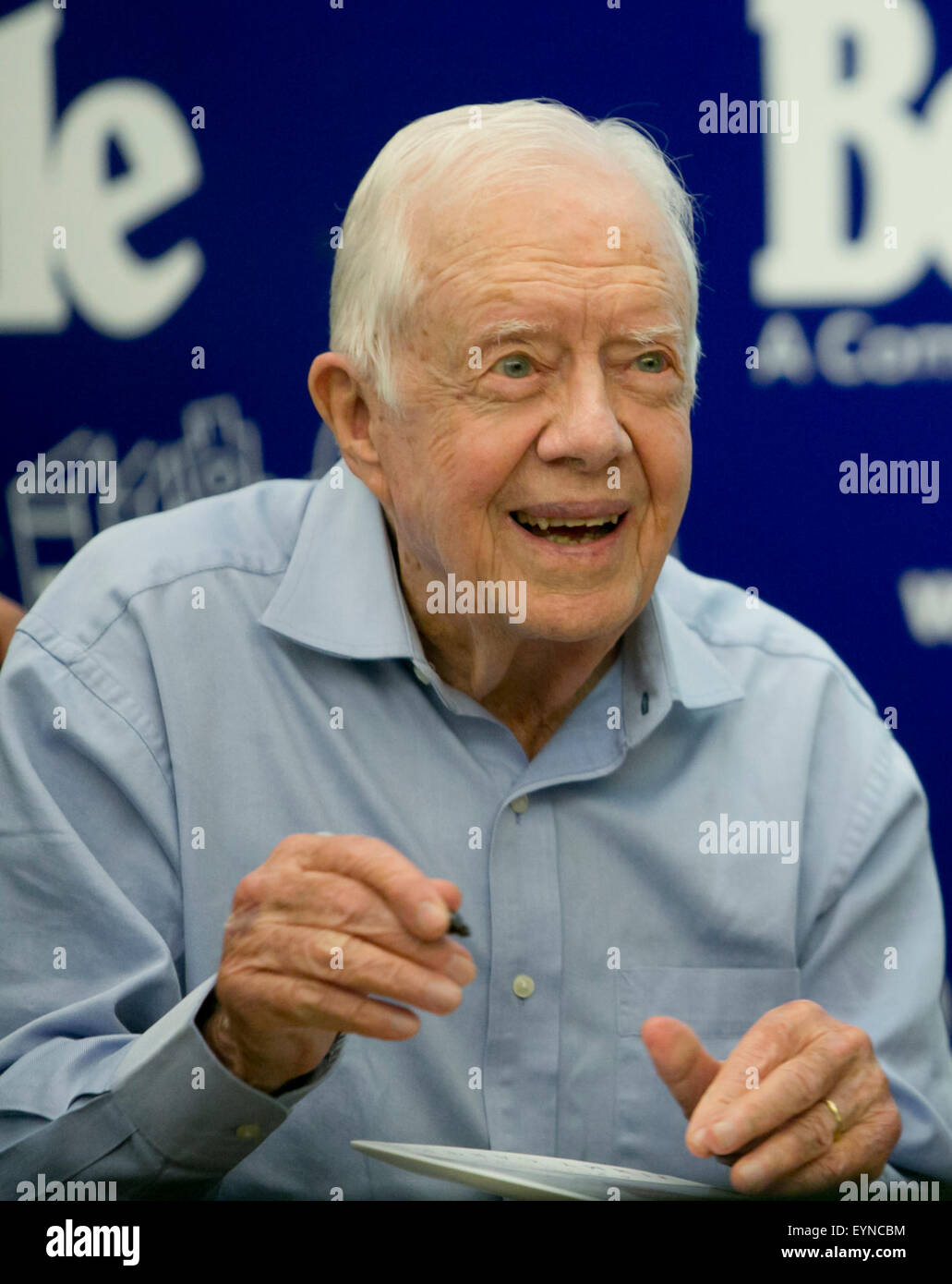 Former President and Nobel Peace Prize winner, Jimmy Carter, signs