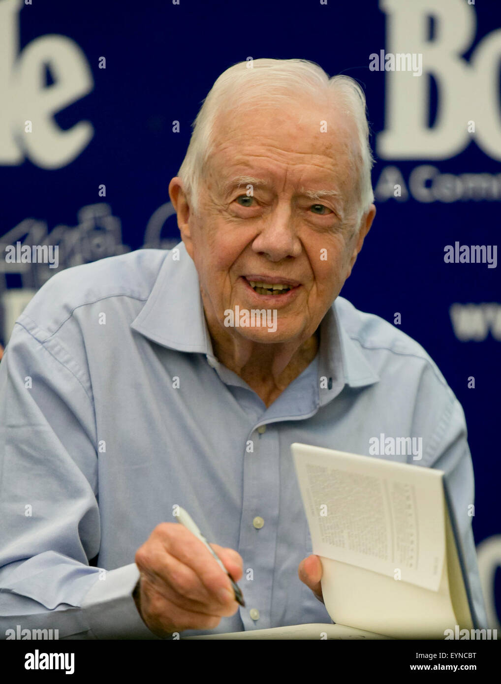 Former President and Nobel Peace Prize winner, Jimmy Carter, signs