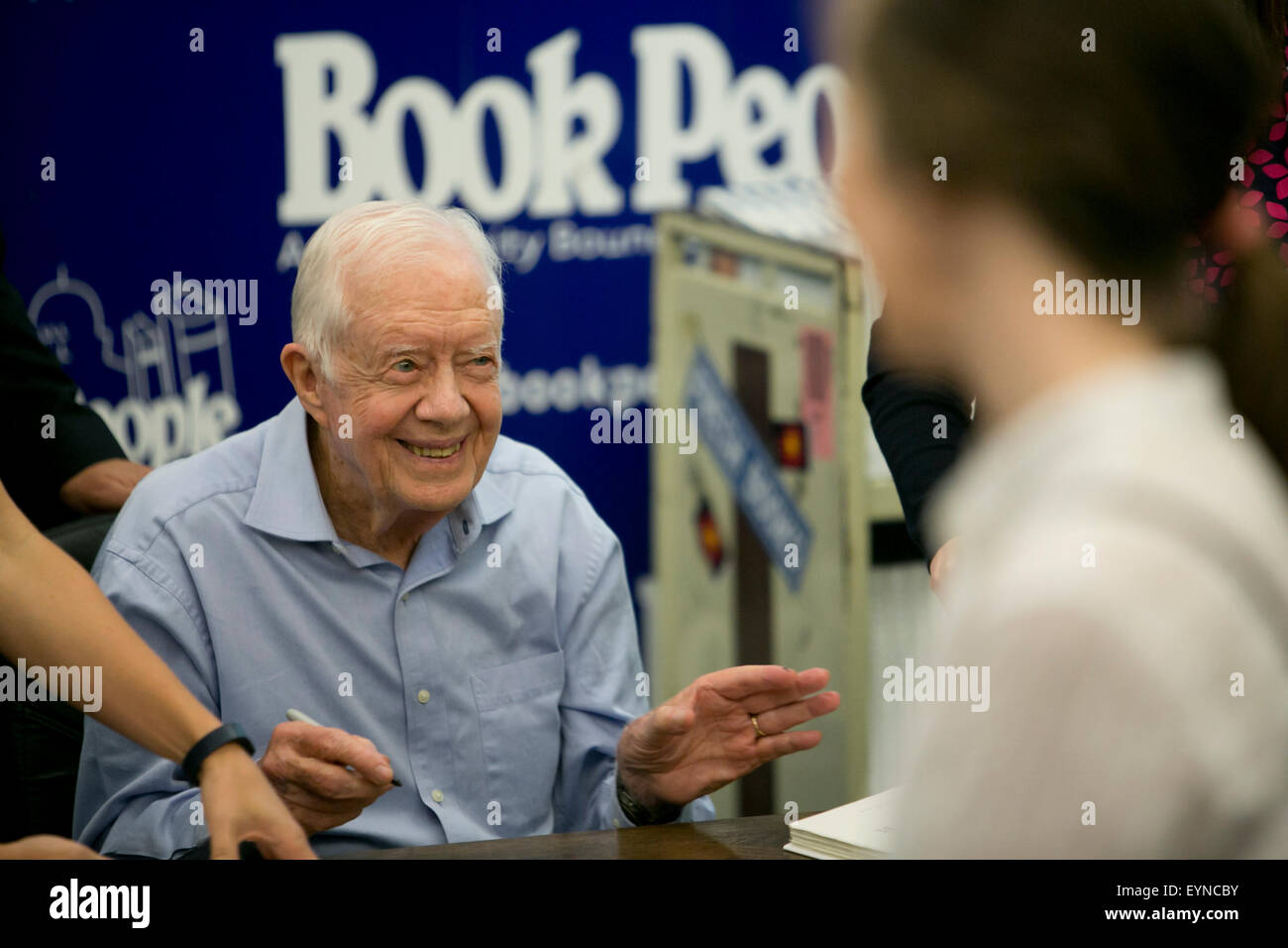 Former President and Nobel Peace Prize winner, Jimmy Carter, signs