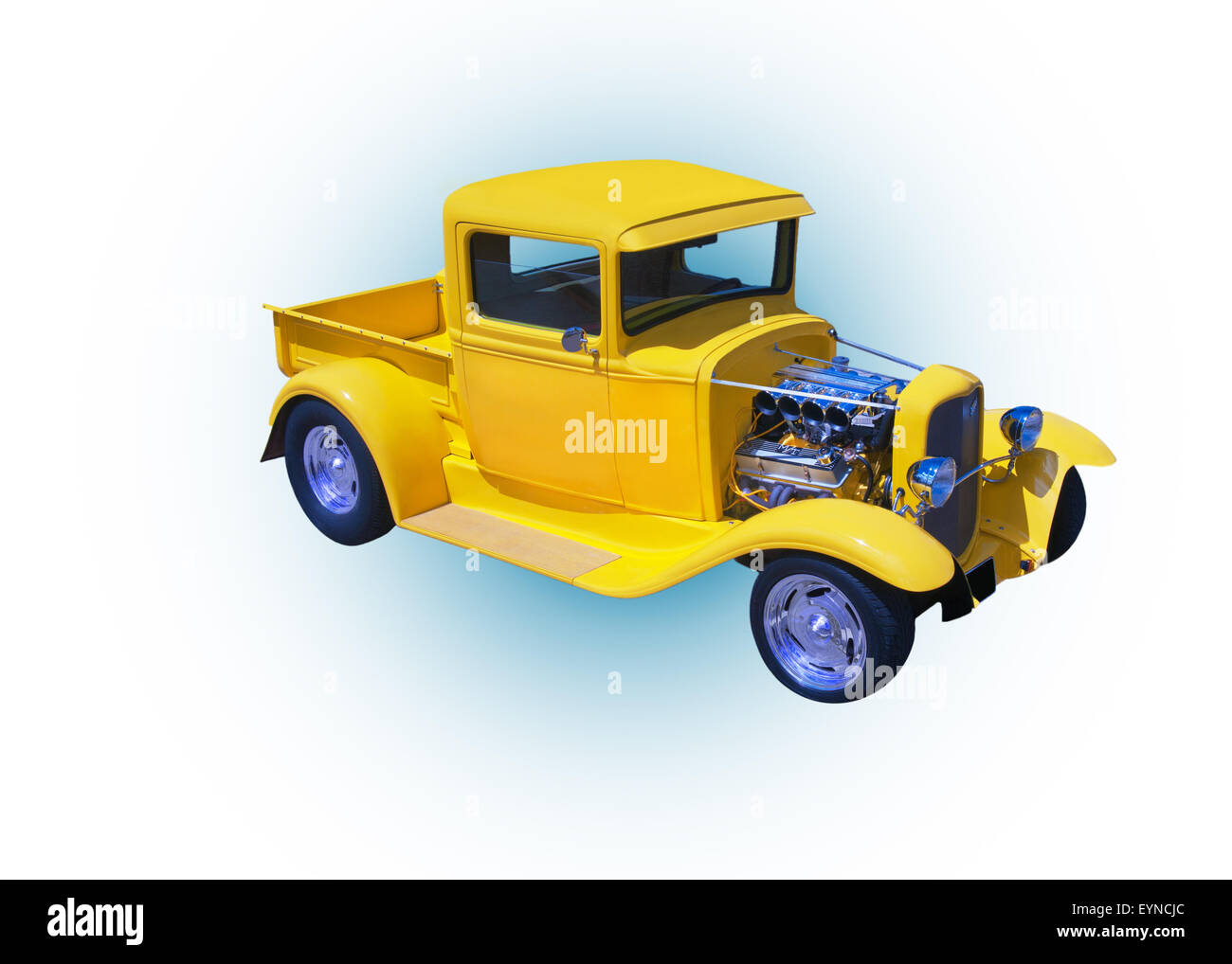 Yellow 1932 Ford Truck model BB on white background with blue dot in the center. Stock Photo