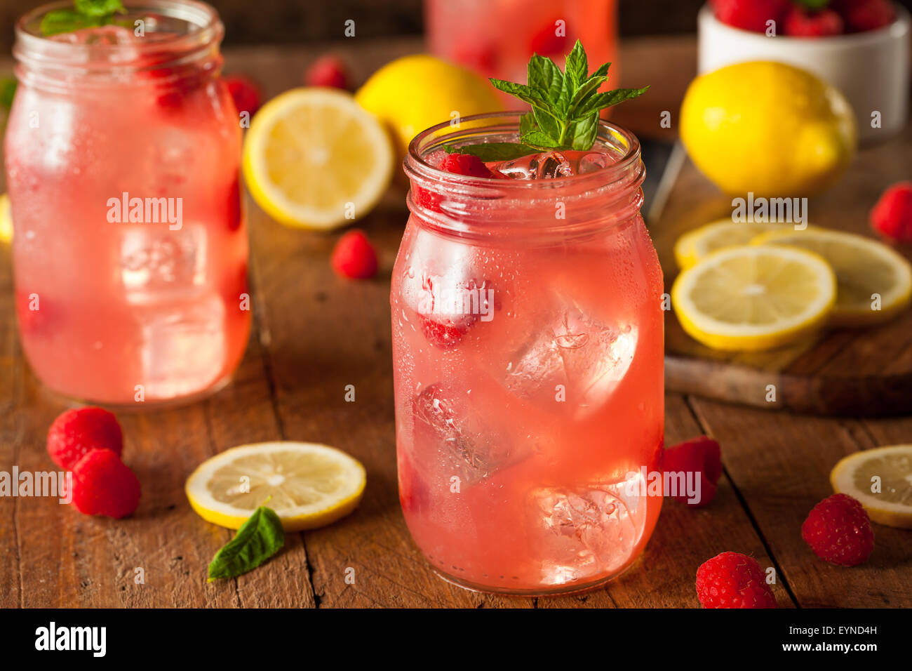 Refreshing Cold Raspberry Lemonade with a Mint Garnish Stock Photo