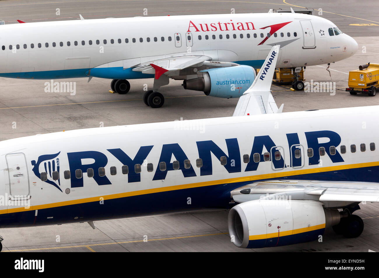 Boeing 737 Ryanair and Airbus A320 Austrian on runway , Blue Danube Airport Linz Stock Photo