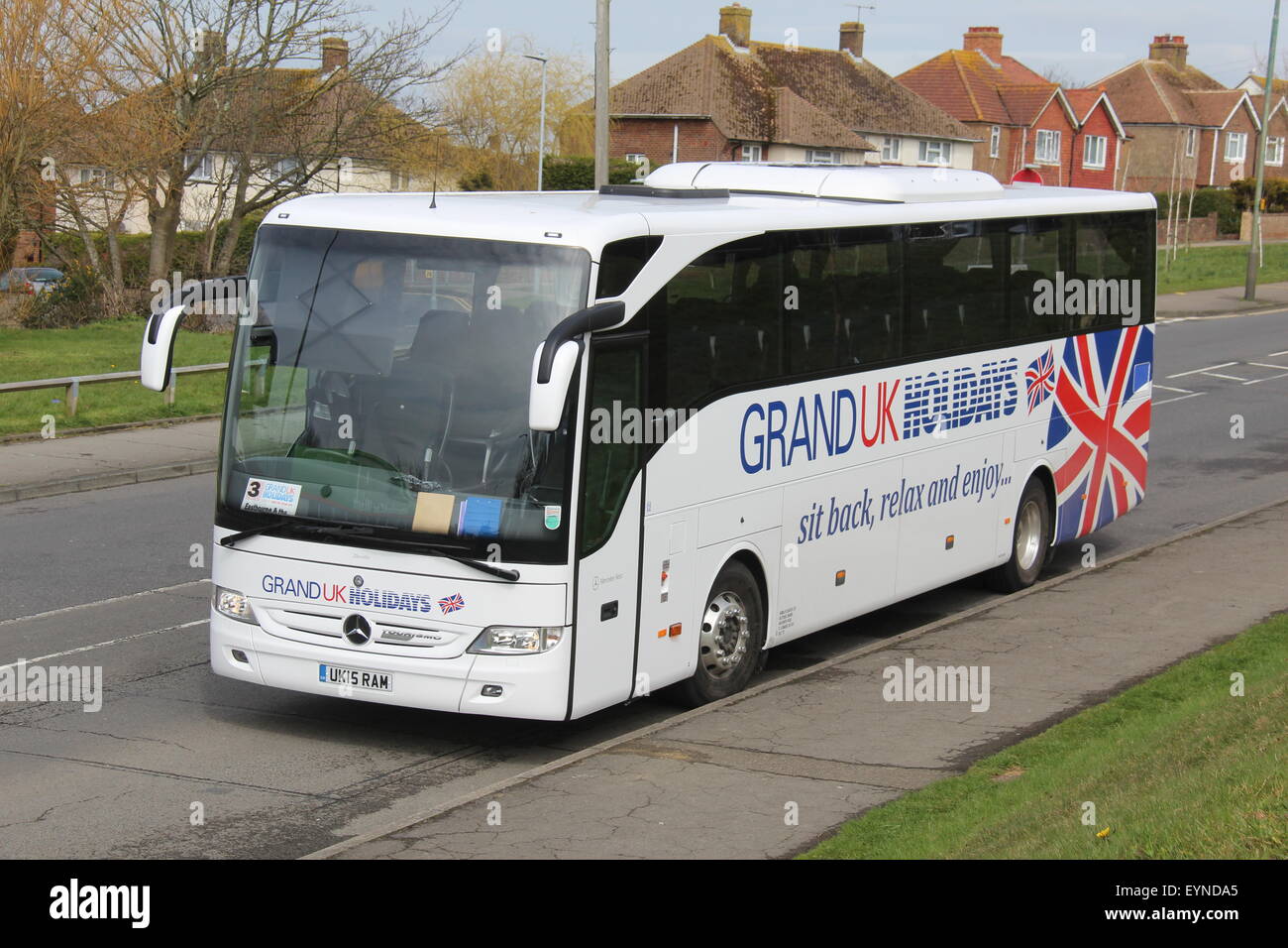 GRAND UK HOLIDAYS LUXURY MECEDES COACH PICTURE OF FRONT AND KERBSIDE Stock Photo