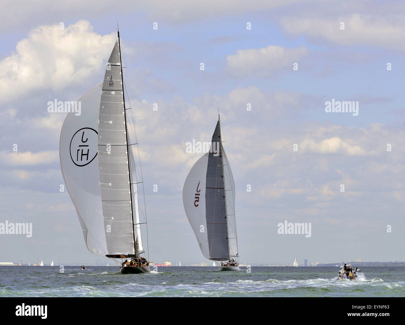 Left to right Lionheart (JH1) ( Nedtherlands),  Ranger(J5)(Caymans), race down wind in The three J-Class yachts race  the Solent on the final day of racing at the Royal Yacht Squadron International Bicentenary Regatta. The overall winner after four days of racing was Velsheda, England, UK Stock Photo