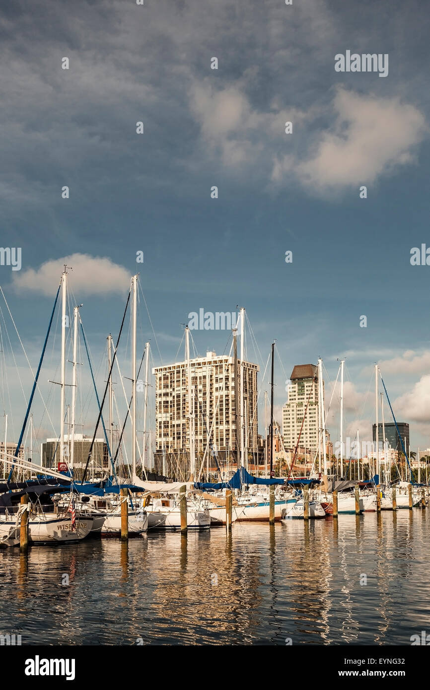 Marina St. Petersburg, Florida with sailboats docked in foreground and cityscape in background. Stock Photo