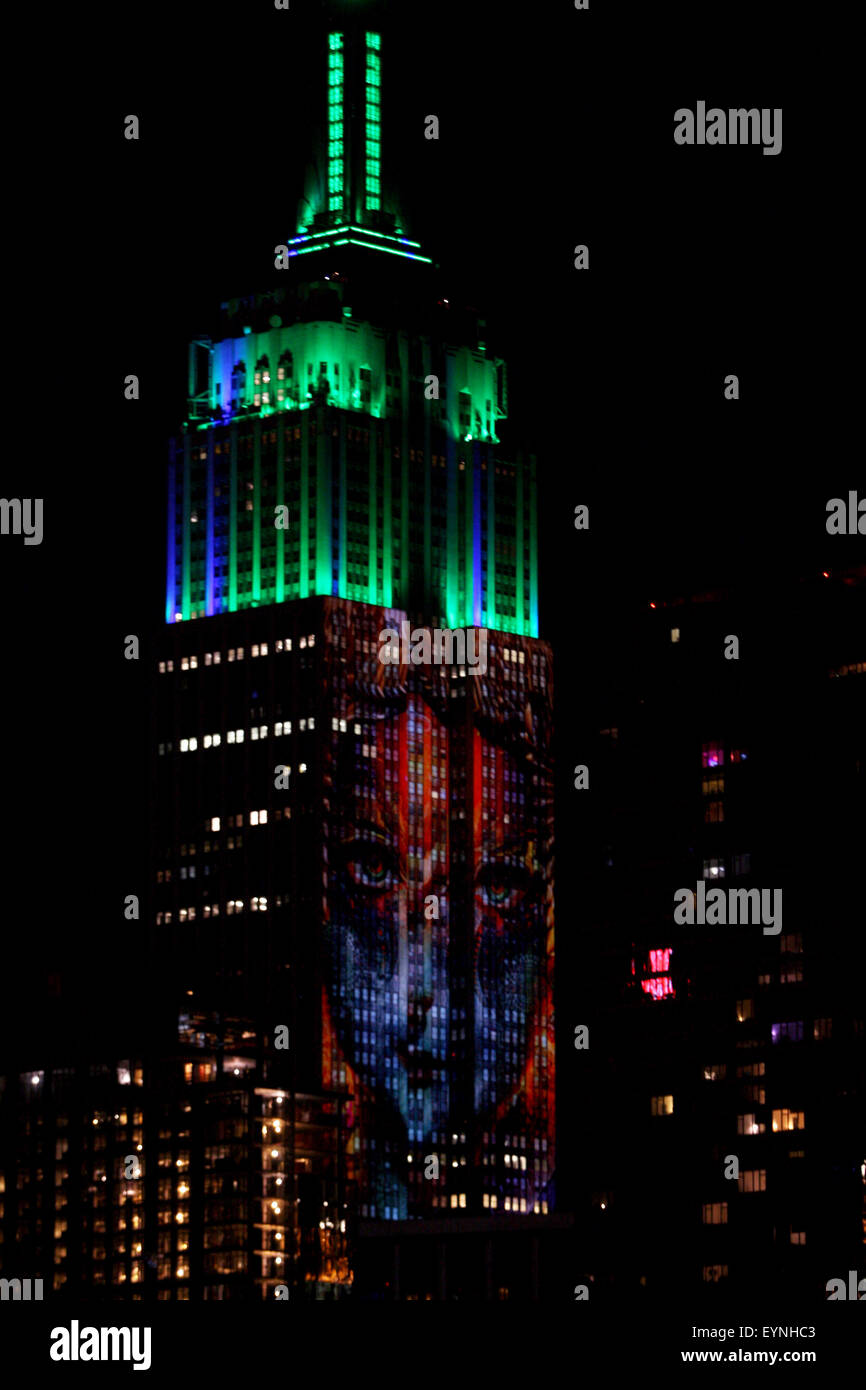New York City, USA. 1st Aug, 2015. Digital images of endangered species are projected onto the south face of New York City's Empire State Building on Saturday evening.  The project, entitled #racingextinction, is the brainchild of filmmaker and photographer Louis Psihoyos and multimedia artist Travis Threlkel, and is designed to raise awareness of the plight of threatened creatures.  The collaborators refer to it as a "weapon of mass instruction."  The images were projected using 40 projectors of 20,000 lumens each. Credit:  Adam Stoltman/Alamy Live News Stock Photo