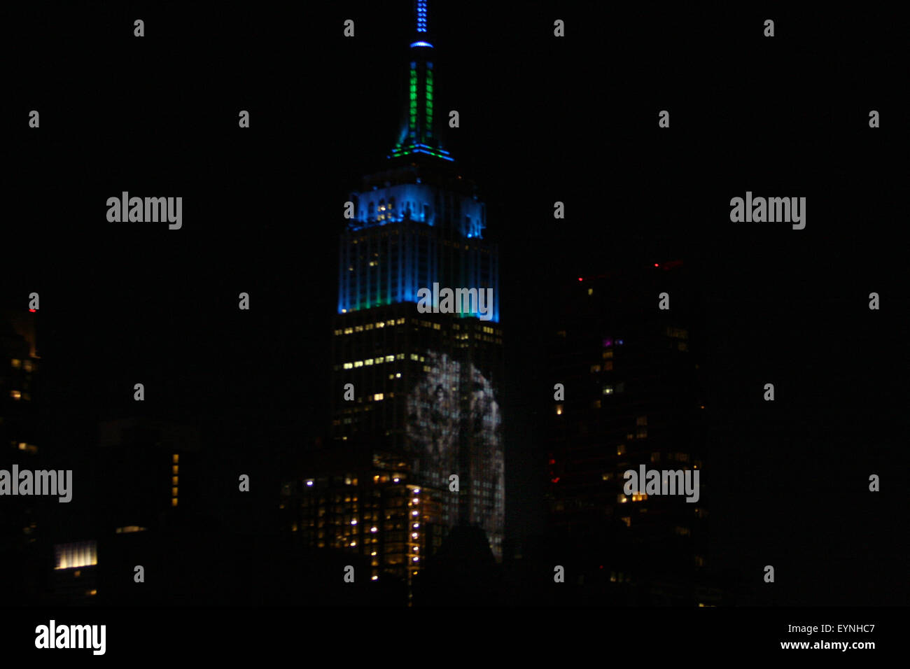 New York City, USA. 1st Aug, 2015. Digital images of endangered species are projected onto the south face of New York City's Empire State Building on Saturday evening.  The project, entitled #racingextinction, is the brainchild of filmmaker and photographer Louis Psihoyos and multimedia artist Travis Threlkel, and is designed to raise awareness of the plight of threatened creatures.  The collaborators refer to it as a "weapon of mass instruction."  The images were projected using 40 projectors of 20,000 lumens each. Credit:  Adam Stoltman/Alamy Live News Stock Photo