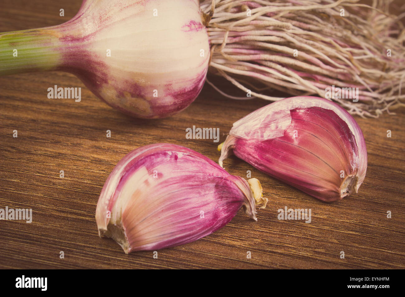 Vintage photo, Fresh whole garlic with roots and cloves on wooden ...