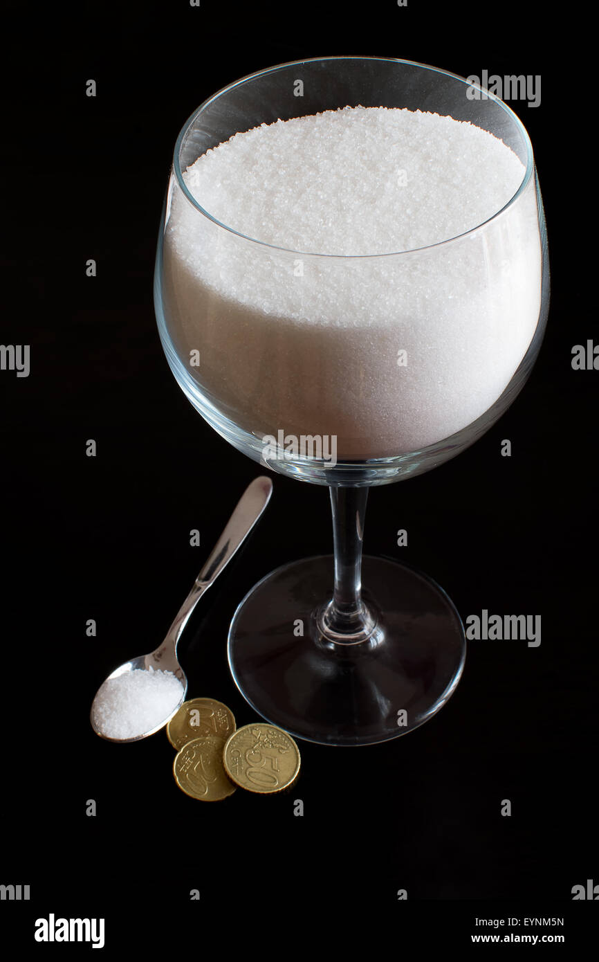 A cup of sugar and its cost Stock Photo